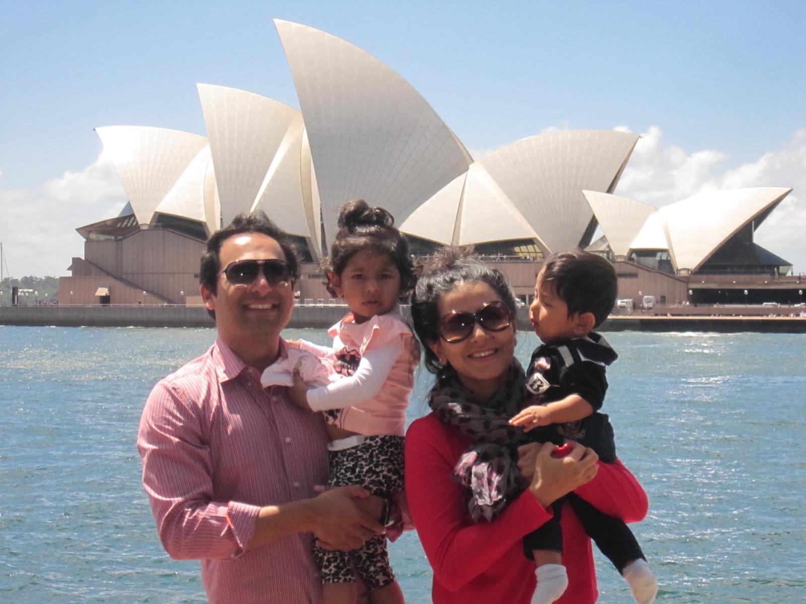 Sania as a child with her family in front of the Sydney Opera House
